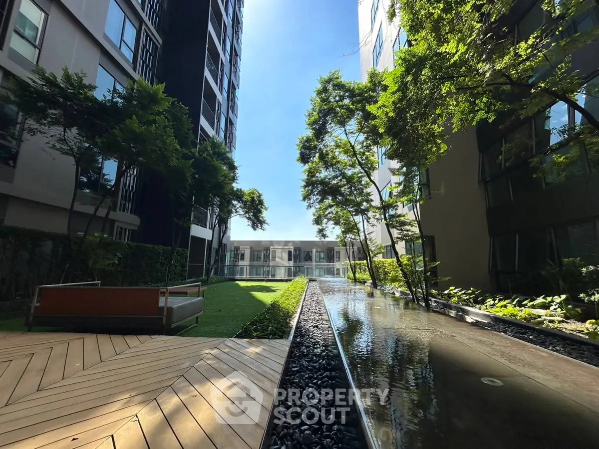 Luxurious garden view with modern architecture and serene water feature
