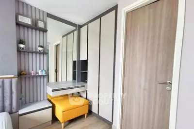 Modern bedroom with stylish wardrobe and cozy seating area