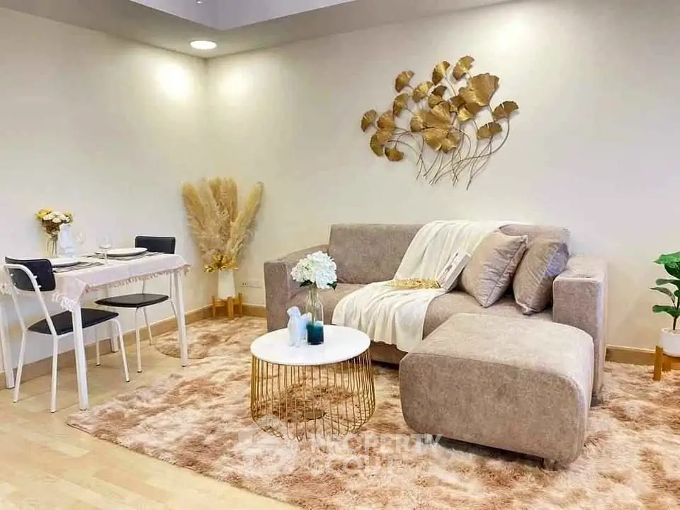 Stylish living room with cozy sofa, chic decor, and elegant dining area.