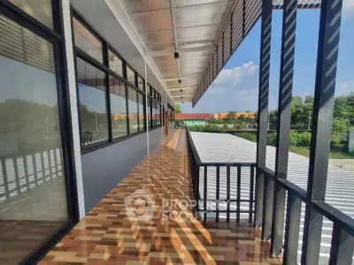 Modern building exterior with spacious balcony and scenic view