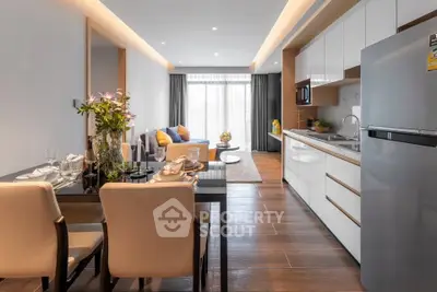 Modern open-layout kitchen and dining area with sleek design and natural light