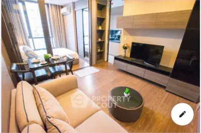 Modern living room with stylish furniture and large windows in a contemporary apartment.