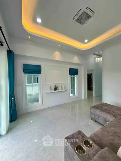 Modern living room with elegant ceiling lights and stylish decor