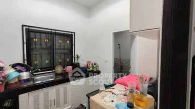 Cozy kitchen with modern appliances and ample counter space, perfect for culinary enthusiasts.