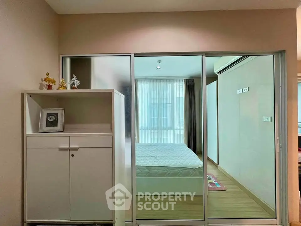 Modern bedroom with sliding glass doors and minimalist decor