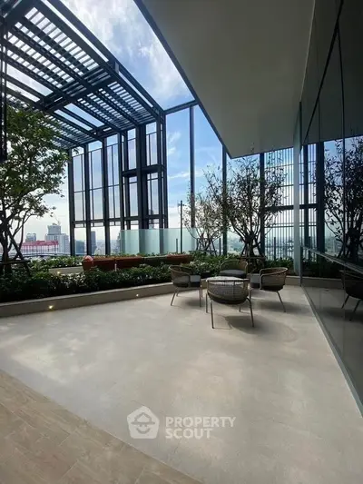 Luxurious balcony with stunning city view and modern outdoor seating area.