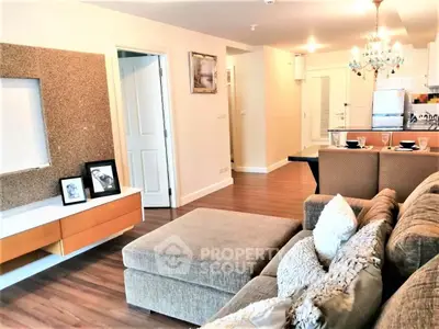 Spacious modern living room with cozy sectional sofa and elegant decor in a stylish apartment.