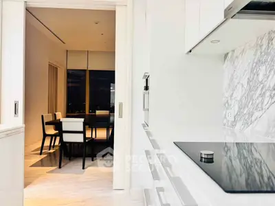 Modern kitchen with sleek design and dining area with city view