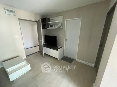 Modern minimalist living room with sleek furniture and neutral tones.