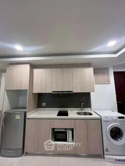 Modern kitchen with built-in appliances and sleek cabinetry