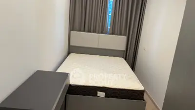 Cozy bedroom with modern bed and stylish curtains, perfect for restful nights.