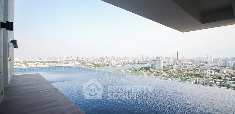 Stunning infinity pool with breathtaking city skyline view from high-rise building