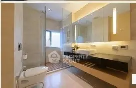 Luxurious modern bathroom with sleek fixtures and glass shower enclosure