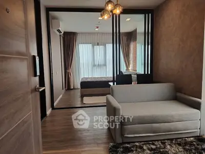 Modern apartment interior with cozy living area and stylish bedroom view.