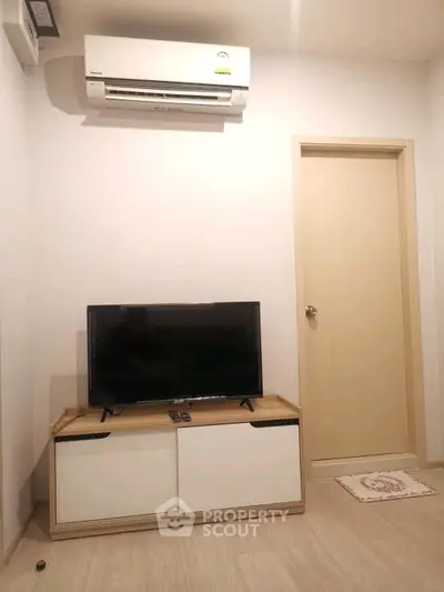 Cozy living room with modern air conditioning and sleek TV setup