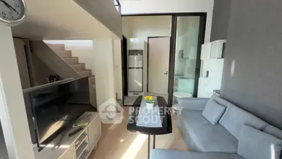 Modern living room with sleek furniture and natural light