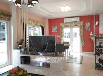 Spacious living room with modern decor and large windows