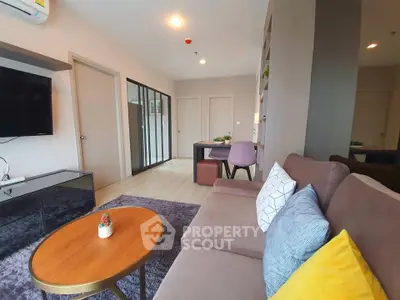 Modern living room with stylish decor and cozy seating area in a contemporary apartment.