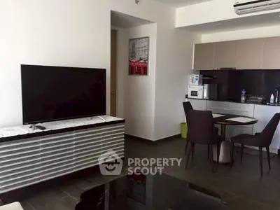 Modern living room with sleek furniture and open kitchen layout