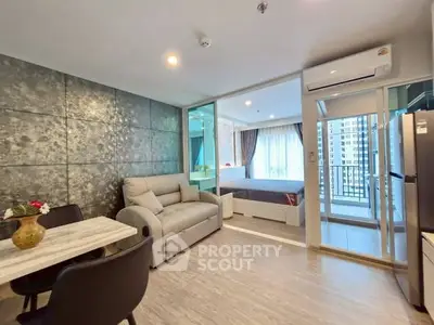 Modern open-plan living room with stylish decor and balcony view
