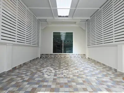 Spacious tiled garage with modern design and ample natural light