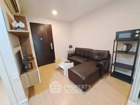 Modern living room with sleek furniture and stylish decor in a cozy apartment.