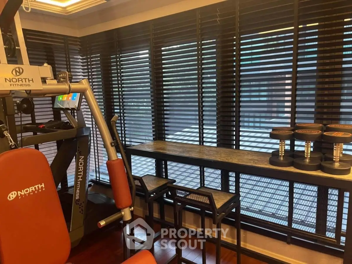 Modern home gym with fitness equipment and stylish decor