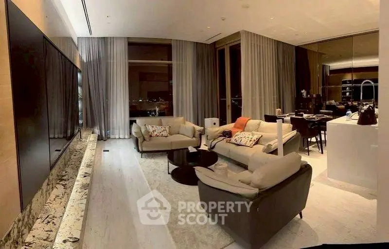 Luxurious modern living room with panoramic city views and elegant furnishings.