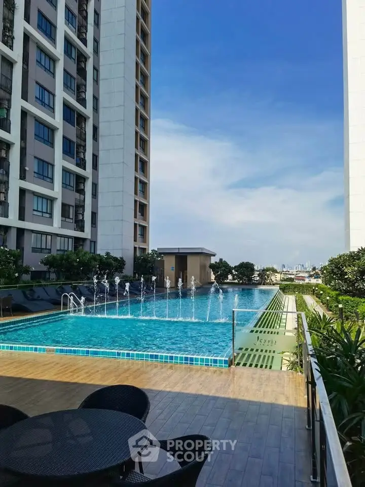 Luxurious high-rise apartment with stunning rooftop pool and city views.