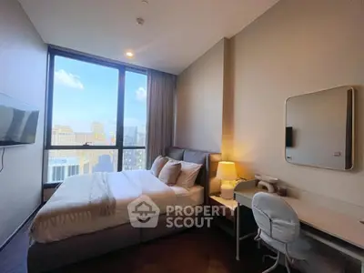 Modern bedroom with city view, featuring cozy bed and study desk, perfect for urban living.