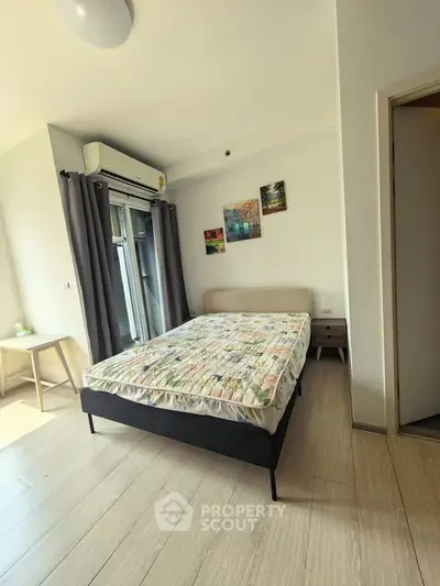 Bright and airy bedroom with modern decor and large window