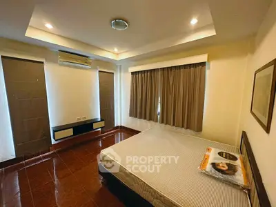 Spacious bedroom with modern design and ample natural light