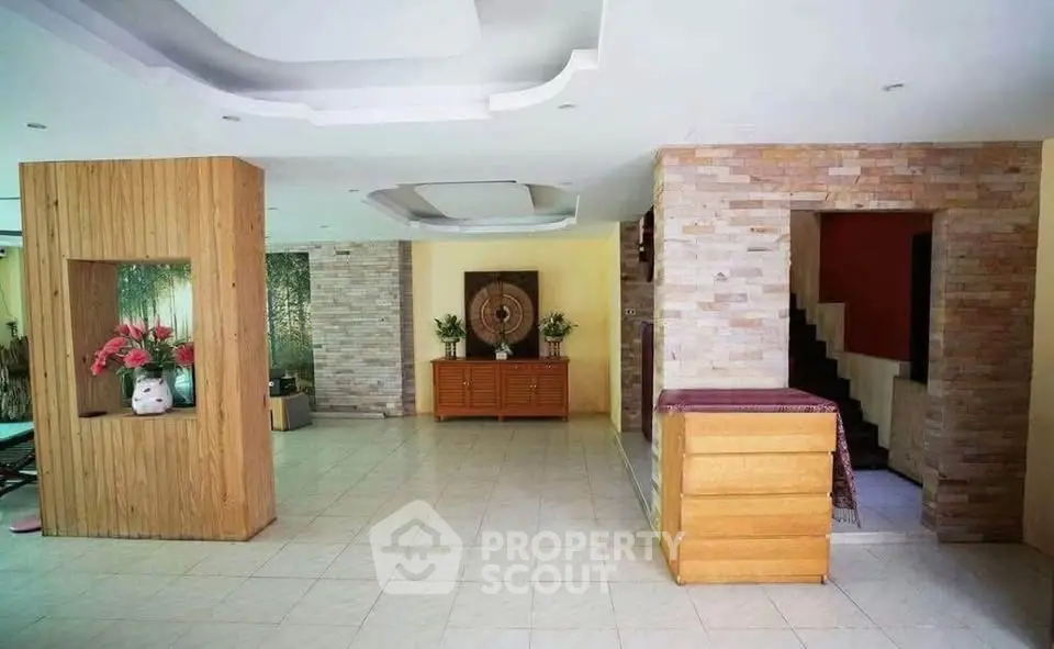 Spacious living room with modern decor and elegant tile flooring