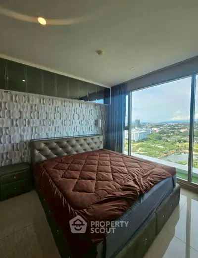Luxurious bedroom with stunning city view and modern decor
