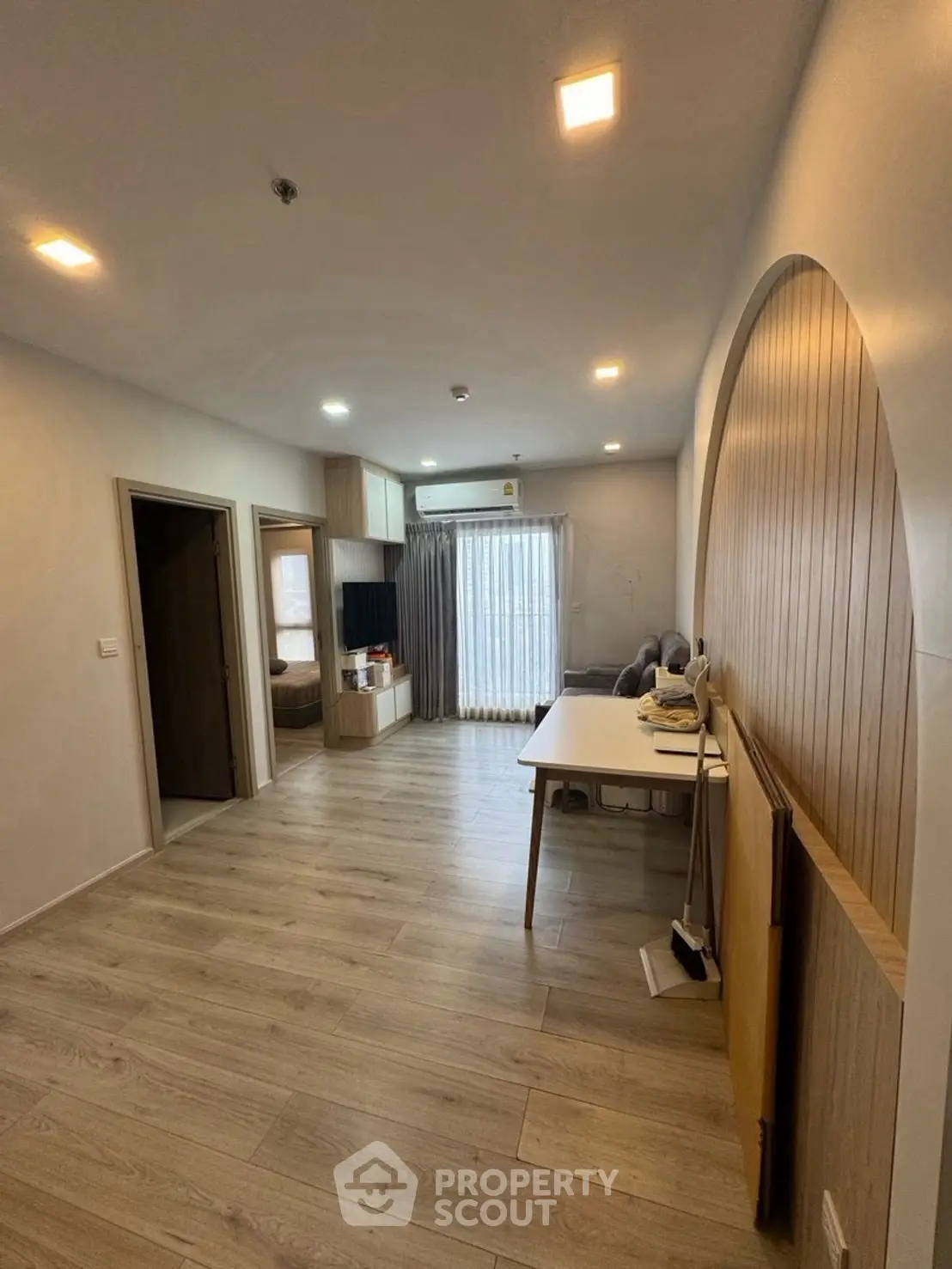 Spacious modern living room with wooden flooring and stylish decor