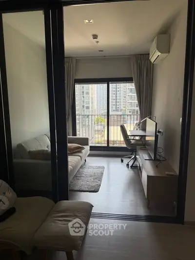 Modern living room with balcony view in urban apartment