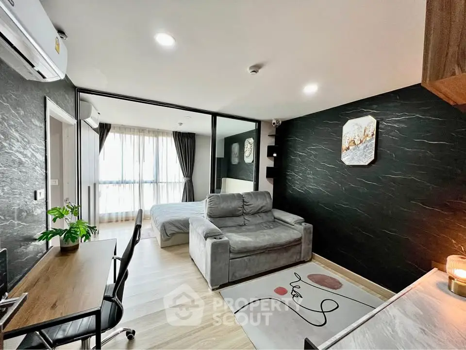 Modern living room with stylish decor and cozy ambiance in a contemporary apartment.