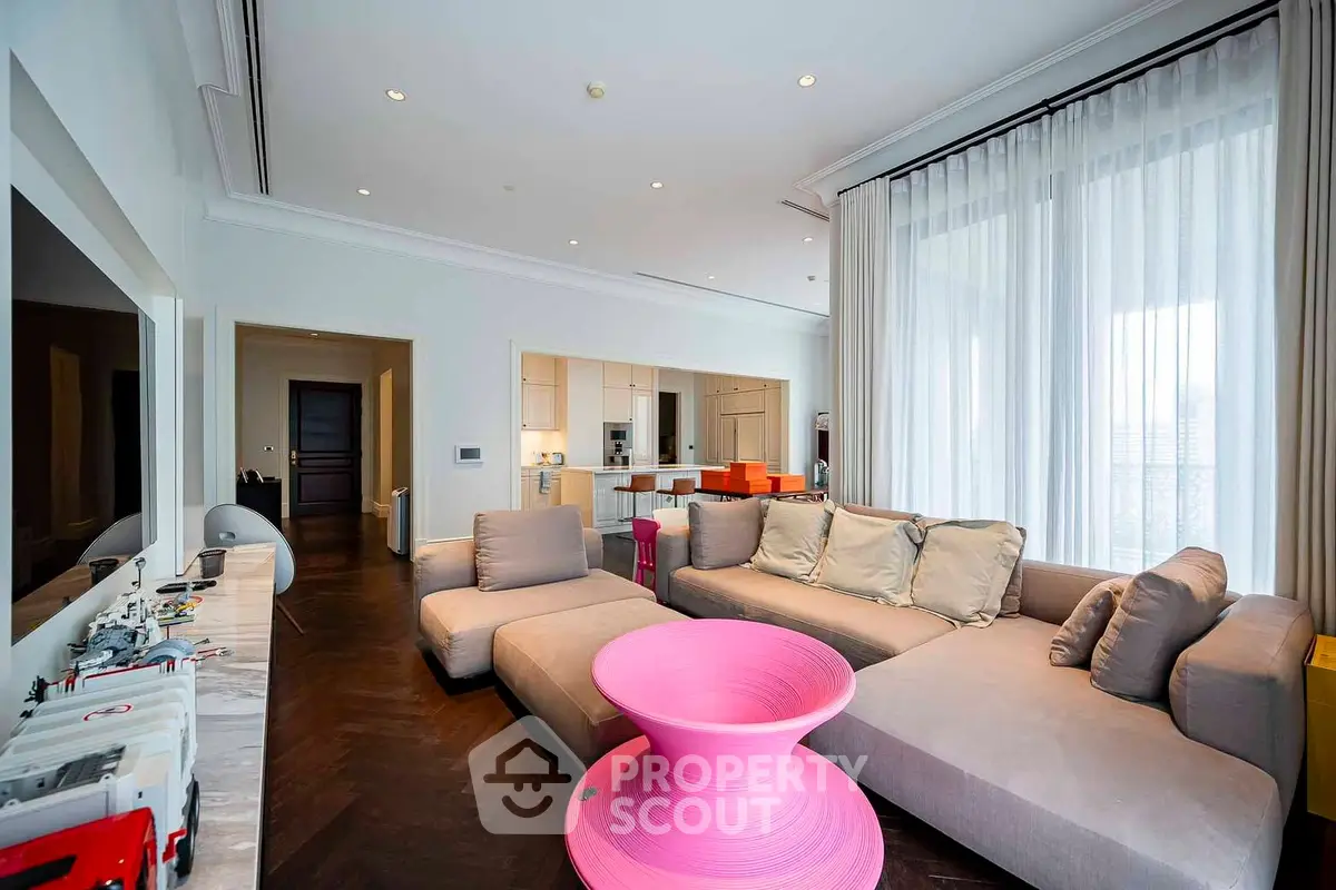 Spacious modern living room with stylish furniture and open kitchen layout