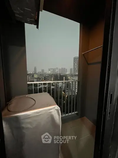 Cozy balcony with city view, perfect for relaxing evenings.