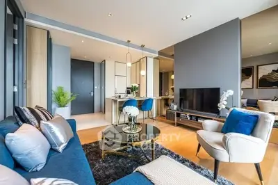 Luxurious modern living room with elegant decor and open kitchen layout