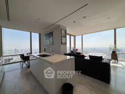 Luxurious modern living room with panoramic city views and sleek open kitchen design.