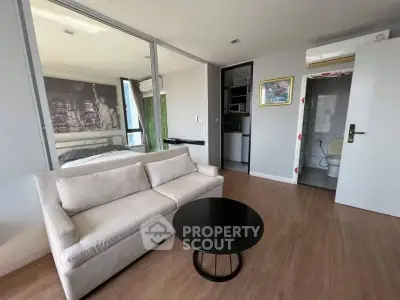 Modern studio apartment with cozy living area and stylish decor