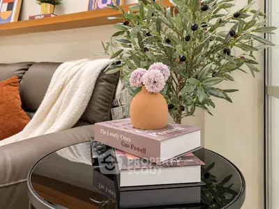 Cozy living room corner with stylish decor and comfortable seating.