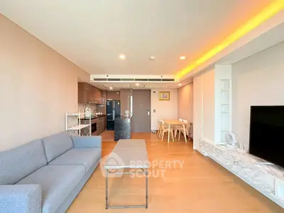 Spacious modern living room with open kitchen and elegant decor