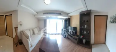 Spacious living room with modern decor and natural light