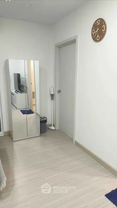 Modern bedroom with mirrored wardrobe and minimalist decor