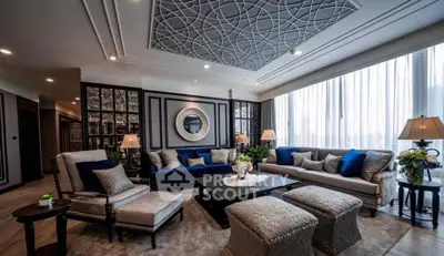 Luxurious living room with elegant decor and large windows offering natural light.
