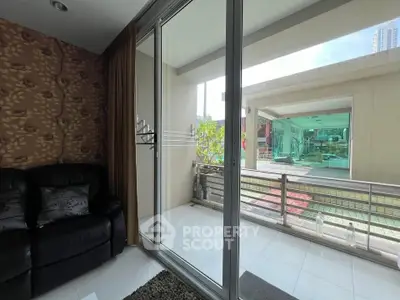 Modern living room with balcony access and city view