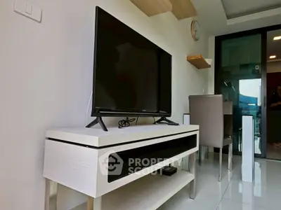 Modern living room with sleek TV stand and wall-mounted shelves