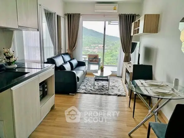 Modern living room with mountain view, sleek furniture, and open layout.